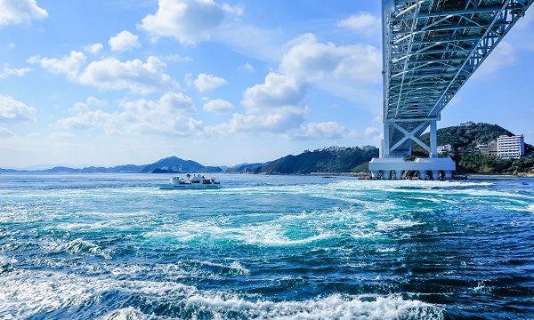 The sightseeing boat passing near the whirlpools of Naruto.